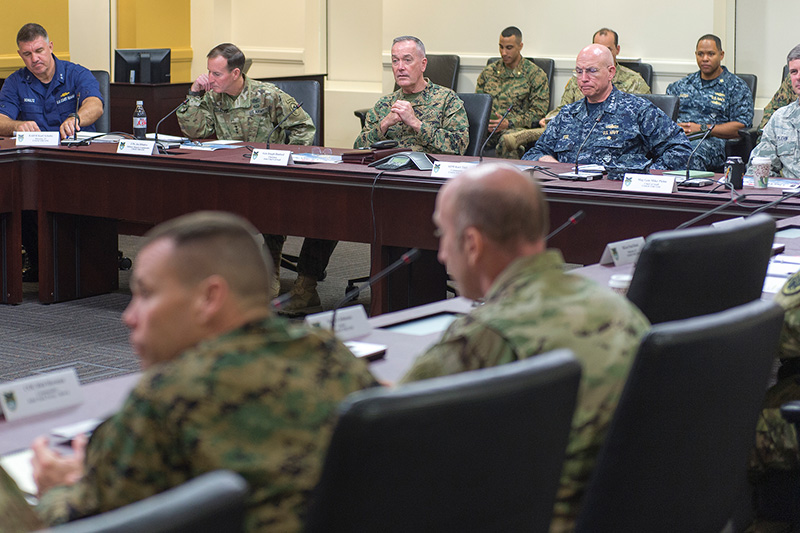 Marine Corps Gen. Joseph F. Dunford Jr., center back, chairman of the Joint Chiefs of Staff, meeting with Navy Adm. Kurt W. Tidd, commander, U.S. Southern Command, and other leaders at the command's headquarters.