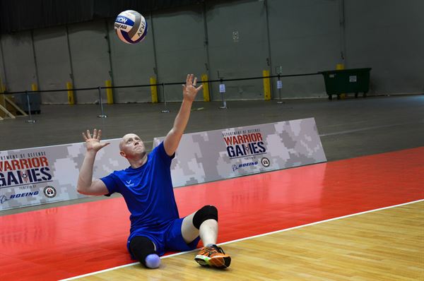 Air Force veteran Austin Williamson, a former developmental engineer officer from Louisville, Colo., serves during team volleyball practice in preparation for the 2017 Defense Department Warrior Games at McCormick Place in Chicago, June 29, 2017. Air Force photo by Staff Sgt. Alex Pons