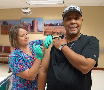 Veteran receiving flu shot