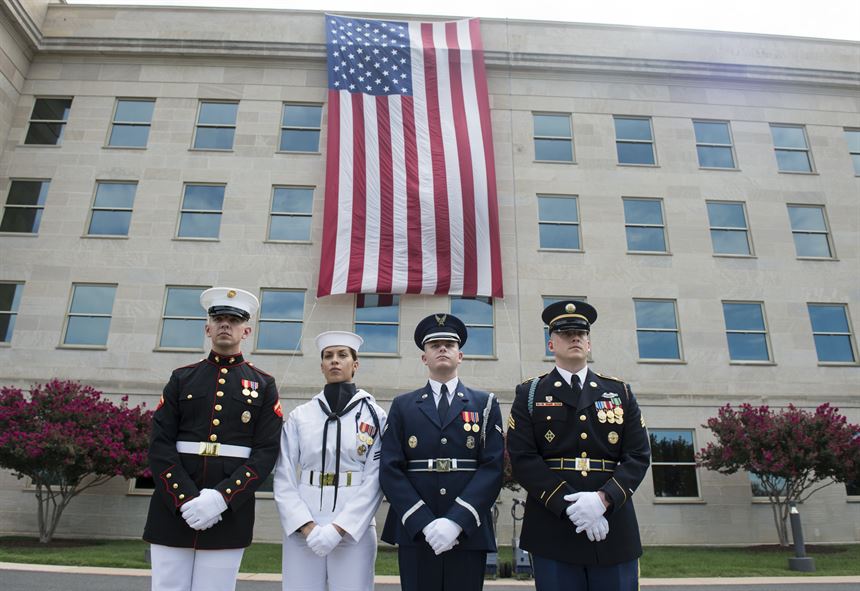 Service members stand after a ceremony at the Pentagon marking the 15th anniversary of the 9/11 attacks.