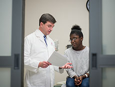 Dr. Greg Armstrong with a study participant