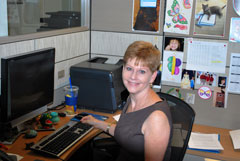 A  USDA/OASCR employee working at her desk