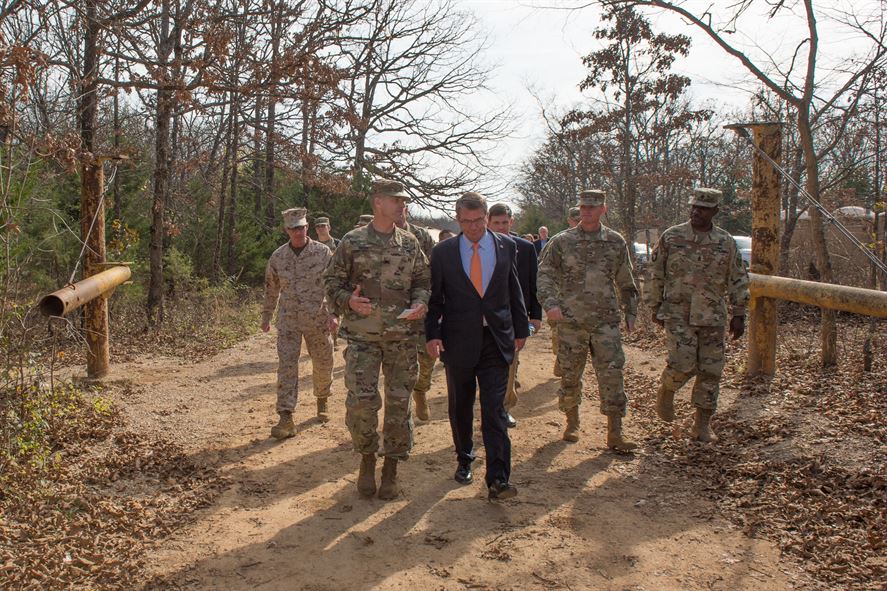 Defense Secretary Ash Carter walks with Army Maj. Gen. Kent D. Savre before a demonstration of the construction of demolition charges at Fort Leonard Wood.