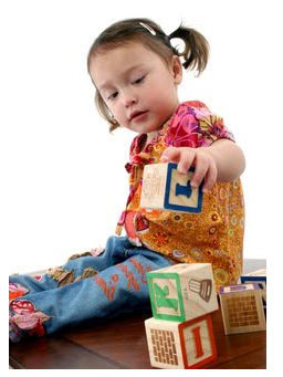 Photo: Child playing with blocks