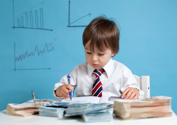 Boy calculating data at desk
