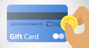 hand holding coin scratching off the personal identification number for a gift card
