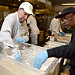 From left: Ed Avalos, Under Secretary for Marketing and Regulatory Programs and Gregory Jones, D.C. Central Kitchen employee help prepare the evening meal at the D.C. Central Kitchen