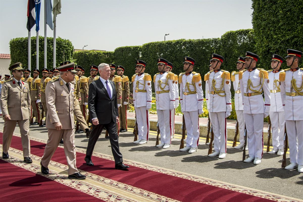 Defense Secretary James N. Mattis walks with the Egyptian defense minister on a red carpet.