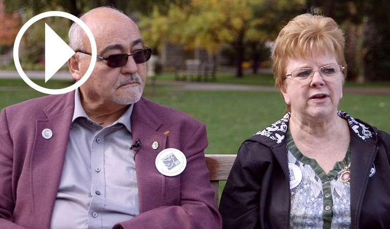 Glenn and Carole Johnson, parents of Pan Am Flight 103 Victim Beth Ann Johnson, with play video symbol overlay.