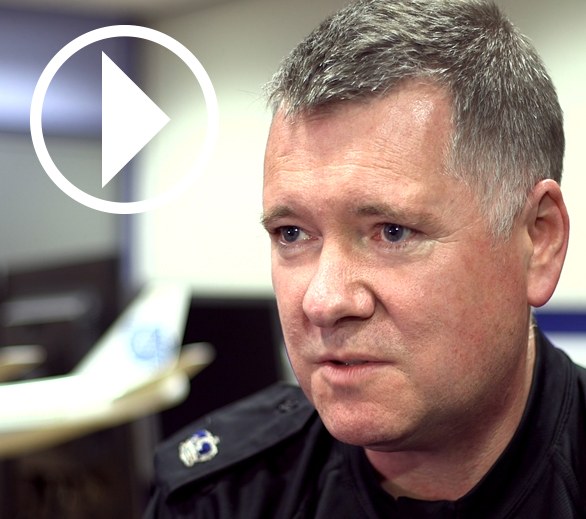 Graeme Galloway, inspector, Police Scotland, with play video symbol overlay.