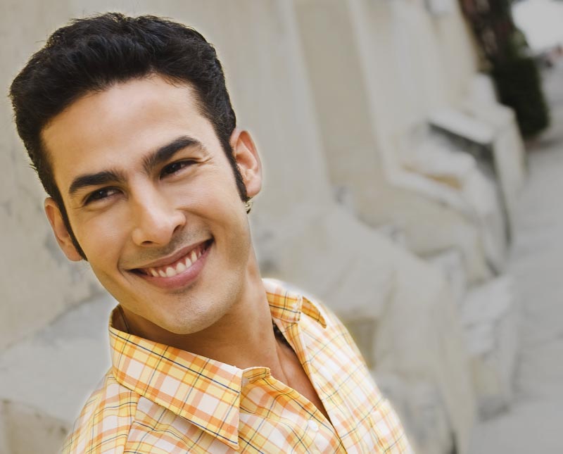 Image of young Latino man smiling
