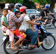 Image of Cambodians on the motorcycles