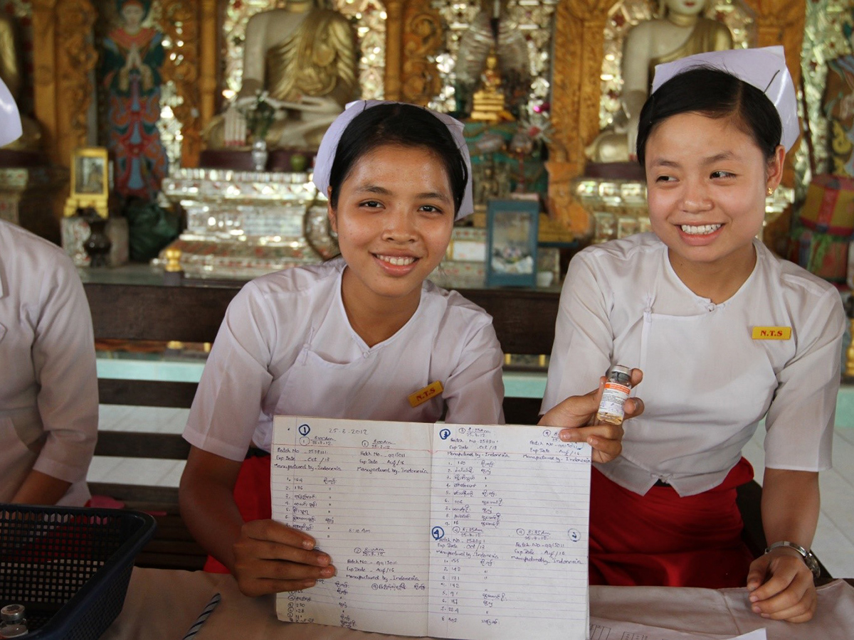 Nurses document their measles vaccination activities.