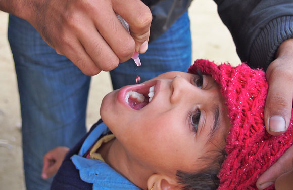 Child receiving the polio vaccine in Nepal