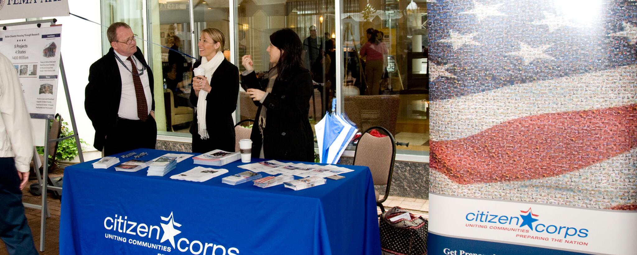 citizen corps members manning a table at a convention