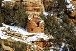 The Painted Hand Pueblo, an Anasazi village inhabited in the 1200s, sits amid the backcountry of Canyons of the Ancients National Monument. The site is named for pictographs of hands painted near its focal point, a large stone tower perched atop a boulder