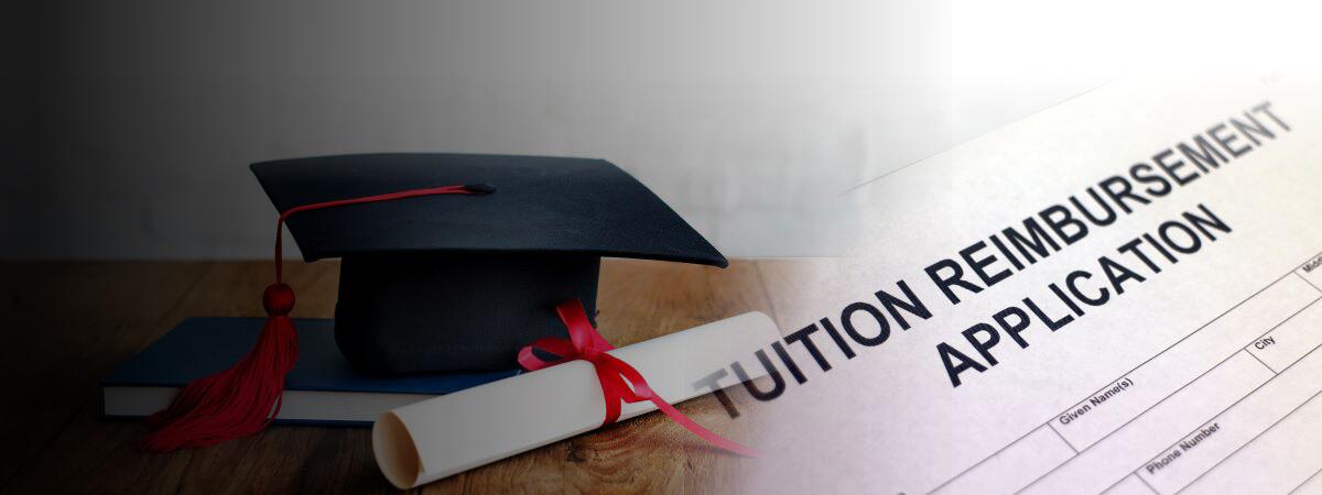 Graduation cap sitting on top of Tuition Reimbursement Application