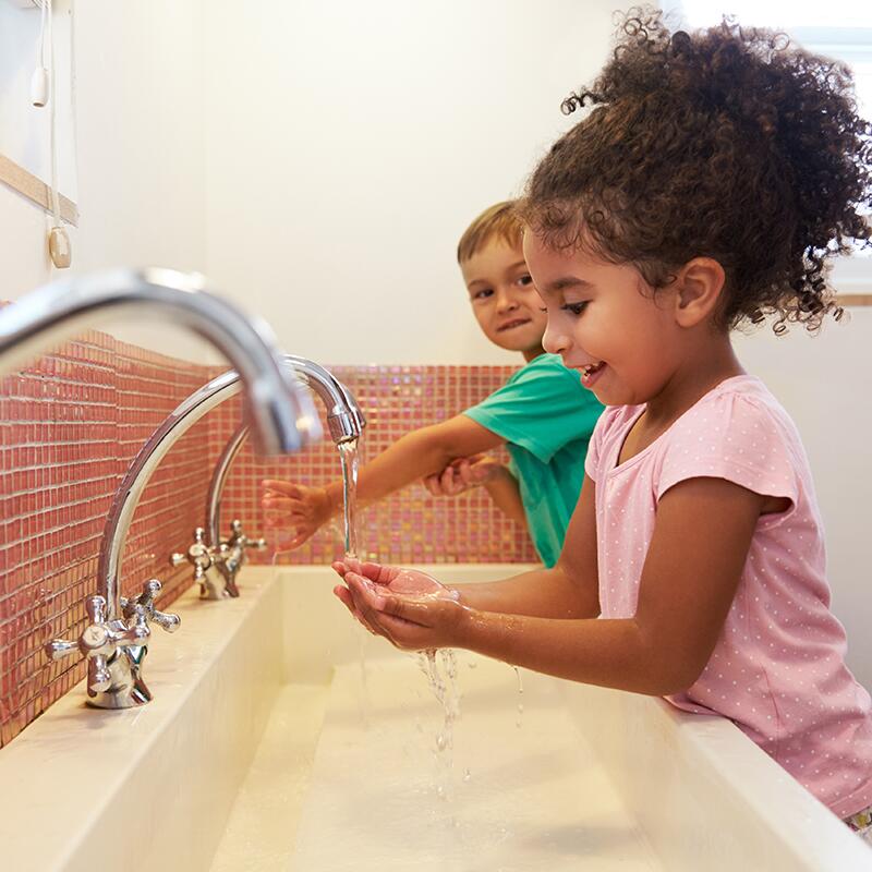 Two Kids washing their hands