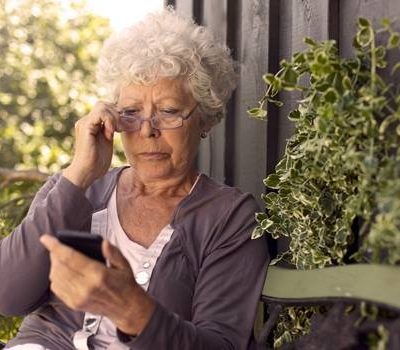 An elderly woman on cell phone