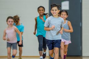 Students running in PE class