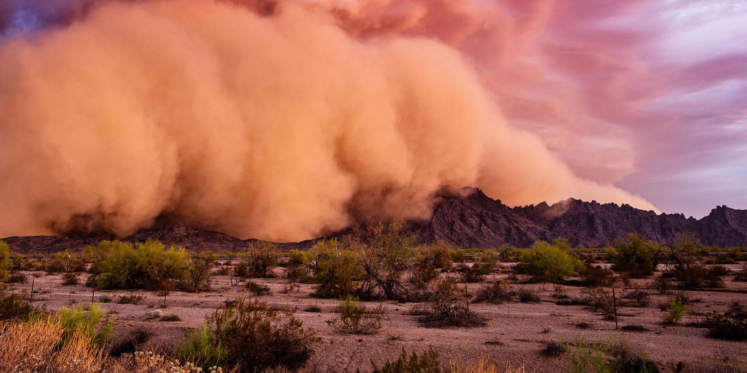 Decorative image. Shows a dust storm crossing mountains.