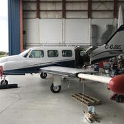 Piper Navajo modified with a tail stinger and wingtip pods 