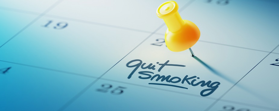 Calendar with a yellow pin and note to quit smoking