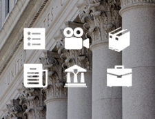 Thick white pillars with ornate decorations at the top. Icons of resources are on top of the image – Access a comprehensive collection of DOJ’s hate crimes resources.
