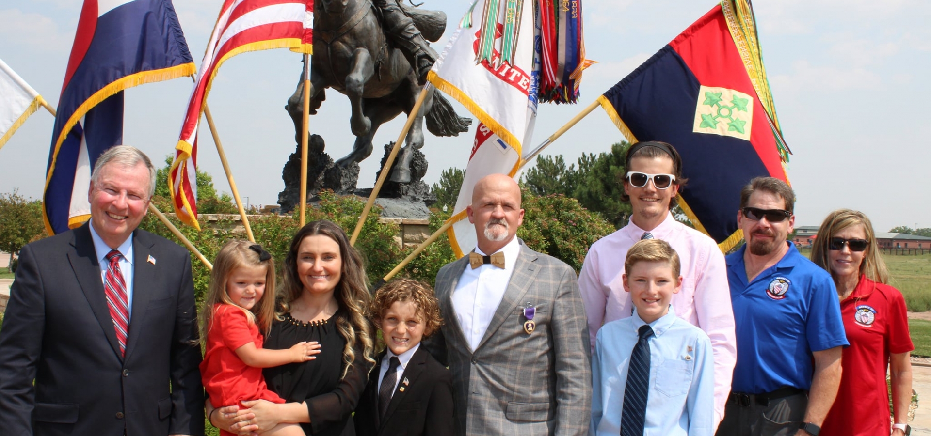 Congressman Lamborn with a veteran and family.
