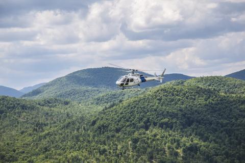 An AS350 crew assists in the hunt for escaped prisoners Richard Matt and David Sweat in upstate New York.