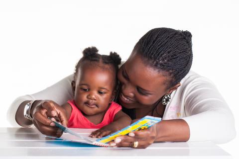 Mother reads to her daughter