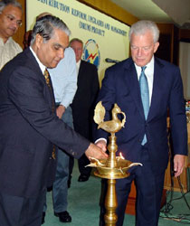 Ambassador David C. Mulford and Secretary, Ministry of Power, Mr. R.V. Shahi lighting the lamp at the launch of the USAID-assisted Distribution Reform, Upgrades and Management (DRUM) Project in New Delhi, October 14, 2004.