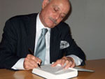 Jeremy Rifkin signing a book after his lecture at Amerika Haus