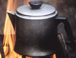 Photo of coffee pot over a camp fire