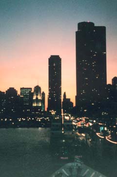 View of city buildings at sunset.