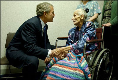 President George W. Bush visits with 94-year-old Anna Tovcimak, who is a hospice patient, after a roundtable discussion on Medical Liability Reform at Mercy Hospital in Scranton, Pa, Jan. 16, 2003.