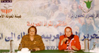 Two women sitting at table, Cairo, Egypt, May 2003.