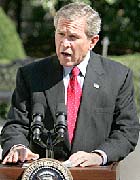 Photo: President George W. Bush talks to reporters Thursday, October 7, about Saddam Hussein's efforts to restart Iraq's WMD program.(AP/WWP)