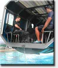 Joint POW MIA Accounting Command teams, based at Hickam Air Force Base, Hawaii, endured water egress training this week. Teams learned to breath and escape from an aircraft crash over water.