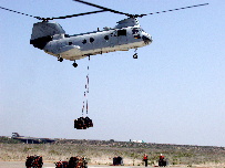 Marine Corps ordnance from Detachment Fallbrook is transported via helicopter to ships at sea.