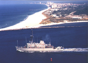 Aerial picture of MCM 1, USS AVENGER, lead ship of the "Avenger" Class mine countermeasures ships, going through pass heading for Gulf of Mexico - Click image to View site