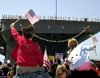 040429-N-3874J-003 San Diego Naval Base, Calif. (Apr. 29, 2004) - Family and friends of the crew assigned to USS Boxer (LHD 4) wait to welcome them home after the ship completed a three-and-a-half month deployment in support of Operation Iraqi Freedom (OIF). This was Boxer's second deployment in less than a year. Boxer provided amphibious lift of essential personnel and equipment for 1st Marine Expeditionary Unit (MEU) and 3rd Marine Aircraft Wing (MAG-3). U.S. Navy photo by Photographer's Mate 2nd Class Daniel A. Jones. (RELEASED) 