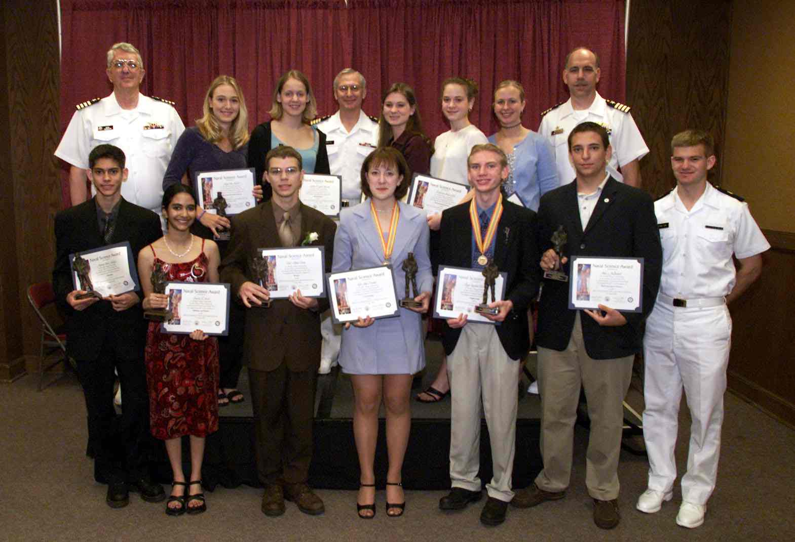 Above:  2001 Naval Science Award $8,000 Scholarship Winners with CAPT D.H. Rau, Commanding Officer of the Naval Research Lab, Retired CAPT James Venette, Chief Judge, Retired CAPT Ronald Johnson, Assistant Chief Judge, and Midshipman 4/C J.C. Payne, U.S. Naval Academy