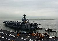 The Nimitz-class aircraft carrier USS Harry S. Truman (CVN 75) departs Pier 14 at Naval Station Norfolk, Va., on a scheduled deployment in support of the global war on terror. 