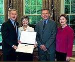 President and Mrs. Bush present a 2004 Preserve America Presidential Award to Dan and Mary King of Ouray, Colorado, for the Beaumont Hotel.