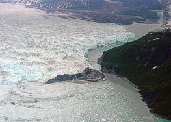 Photo of Hubbard Glacier near closure of Russell Fiord, June 20, 2002 (click on image for enlargement, 80 KB).