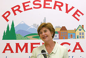 First Lady Laura Bush stands in front of the Preserve America logo (photo copyright 2003 Mobile Register)