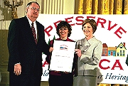 Laura Bush presents a certificate to two representatives of Dorchester County, Maryland, a designated Preserve America Community (photo: Susan Sterner, White House)