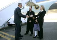 President George W. Bush met Blake and Mona Schomas upon arrival in Wilkes-Barre, Pennsylvania, on Wednesday, October 6, 2004.  The Schomases founded Home of Their Own, a sterile home environment where families can reside, free of charge, while their children recover from bone marrow transplant surgery.