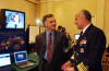 Photo of Surgeon General Carmona chats with a technology showcase exhibitor